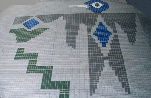 Mosaic bird on a patio.